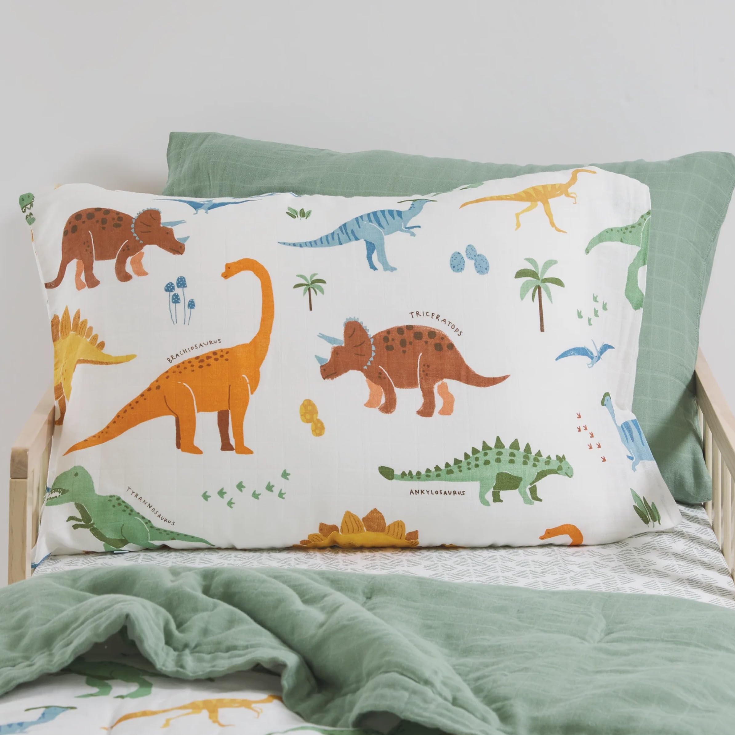 Little Unicorn dino names pillowcase envelope closure demonstrates secure fit for tidy bedtimes