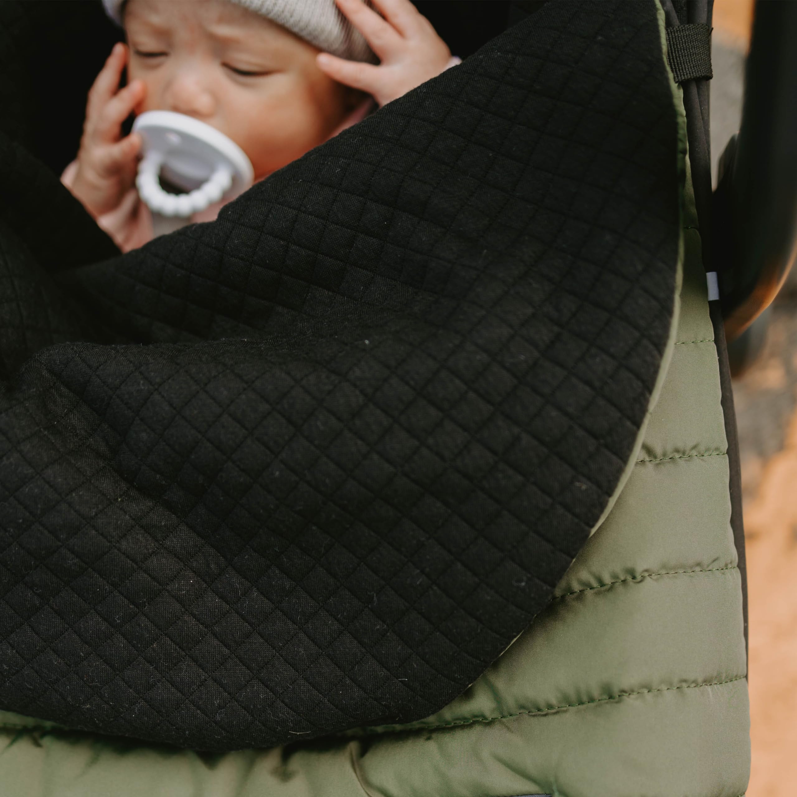 Non-slip backing on Little Unicorn footmuff keeps it in place for a steady ride