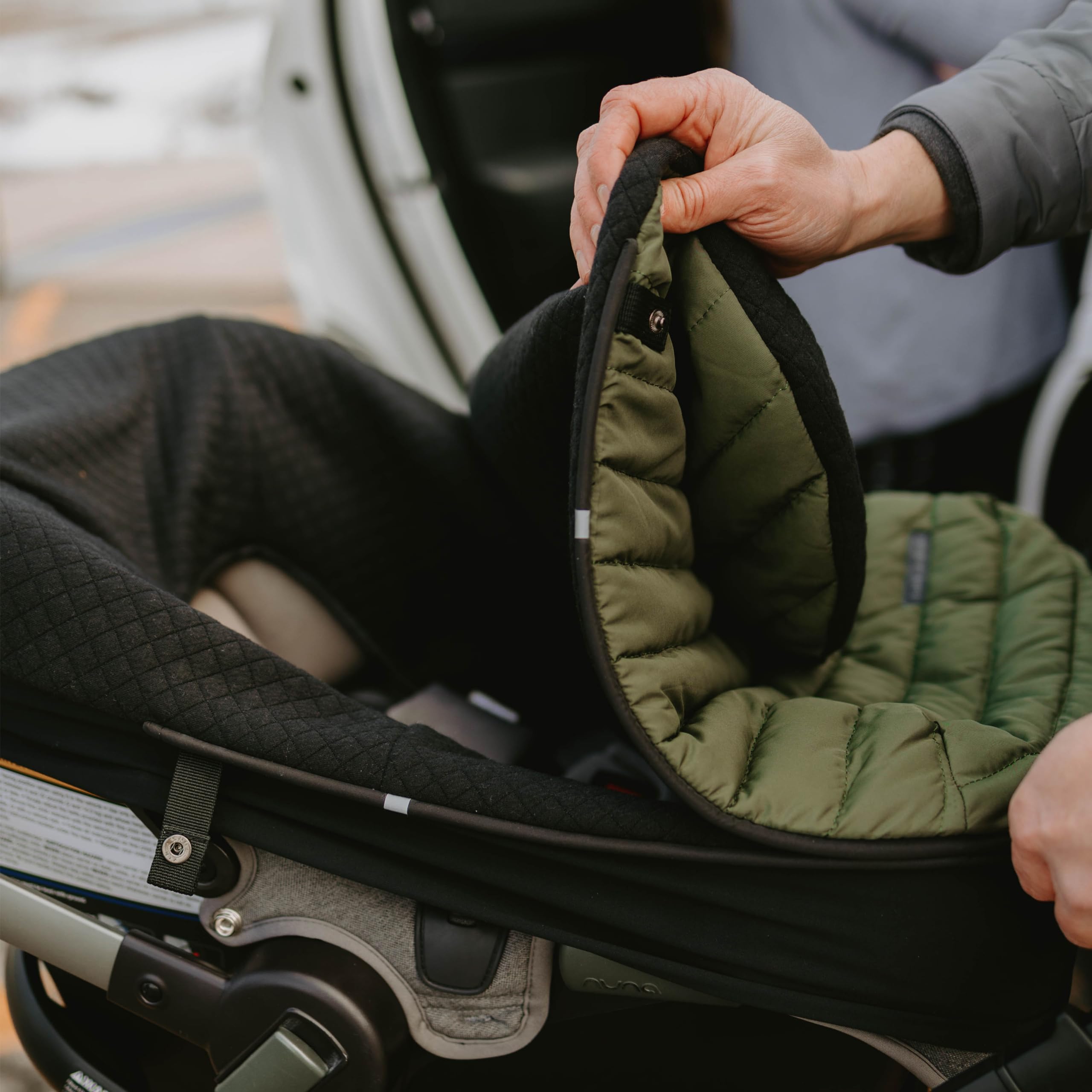 Weather-resistant exterior on Little Unicorn footmuff blocks wind and light rain