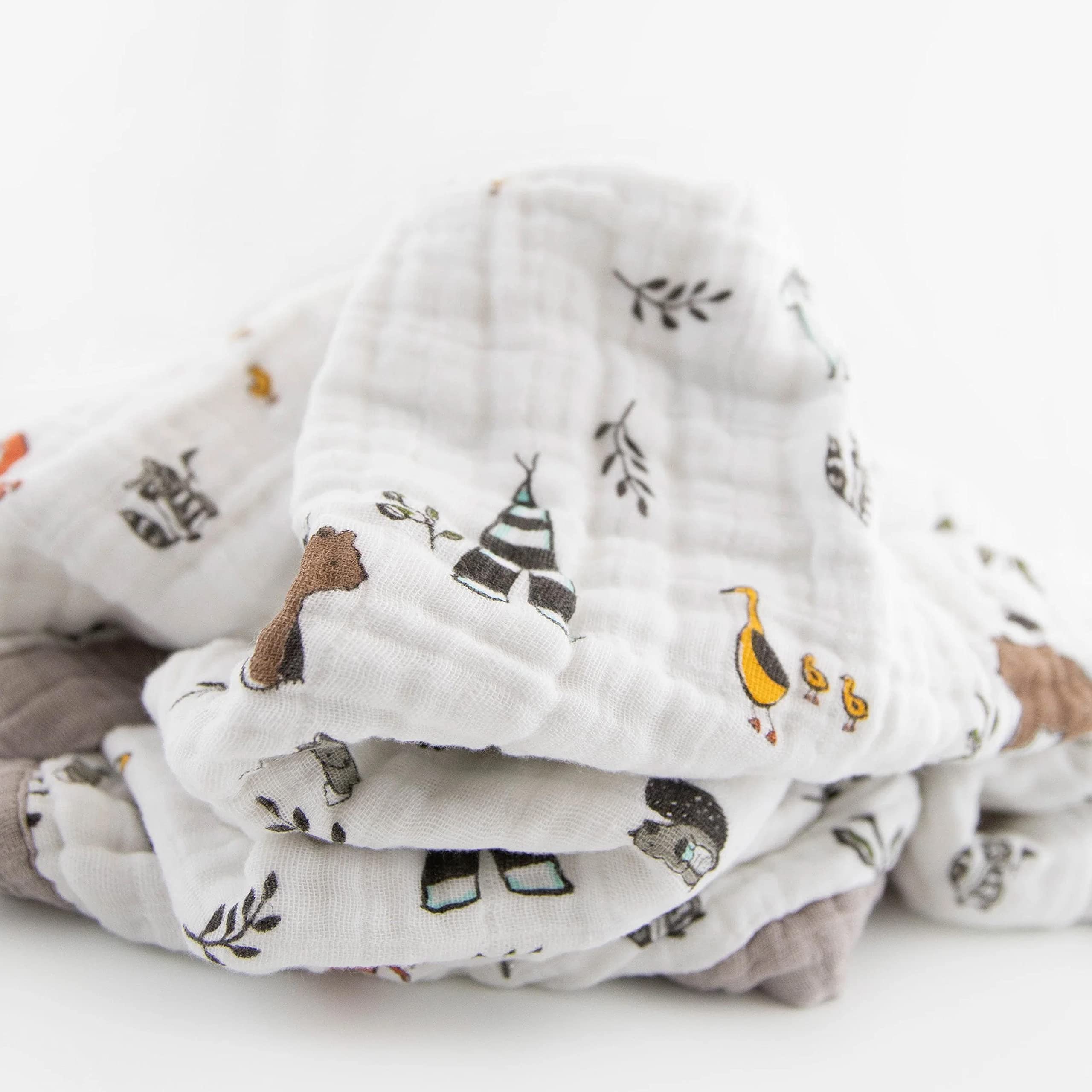 Little Unicorn Forest Friends quilt car-seat wrap for easy travel and security.