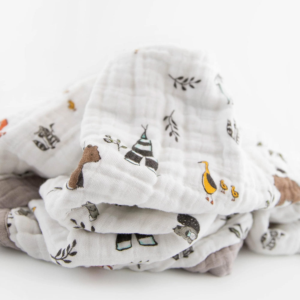 Little Unicorn Forest Friends quilt car-seat wrap for easy travel and security.