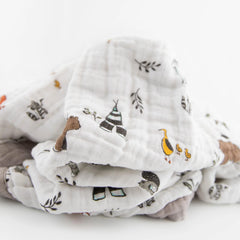 Little Unicorn Forest Friends quilt car-seat wrap for easy travel and security.