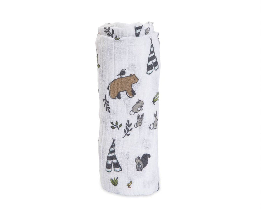 Little Unicorn Forest Friends swaddle laid out for tummy time