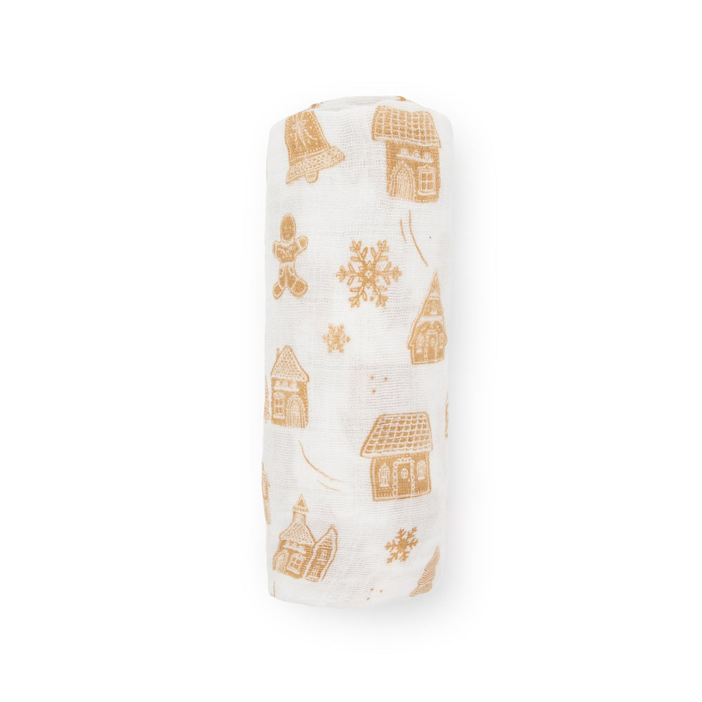 Little Unicorn Gingerbread Village machine-washable swaddle designed for durable, easy care.