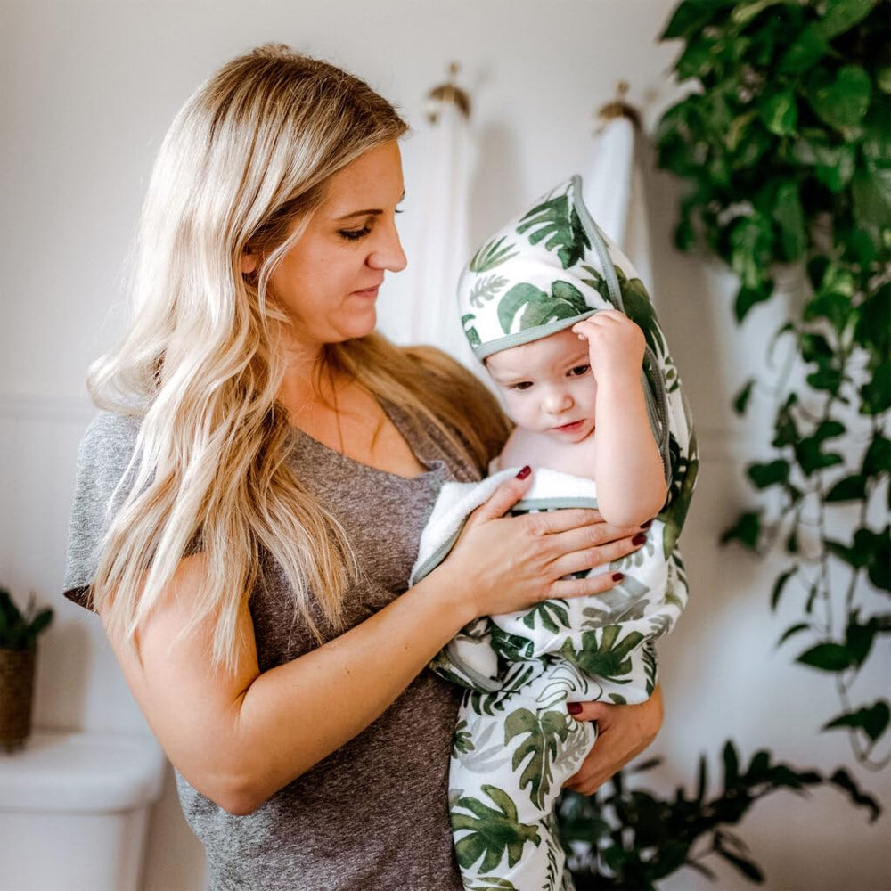 Little Unicorn hooded towel tropical leaf size 30x30 suitable for newborns.