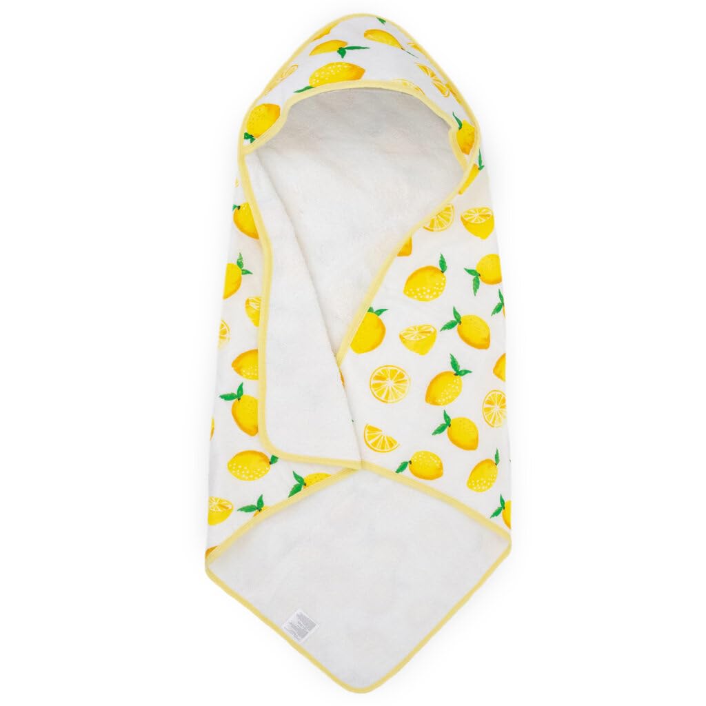 Little Unicorn lemon hooded towel in nursery setup complements bath time routine and decor.