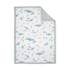 Little Unicorn Lofty Comforter whales close-up shows soft, breathable warmth for bedtime.