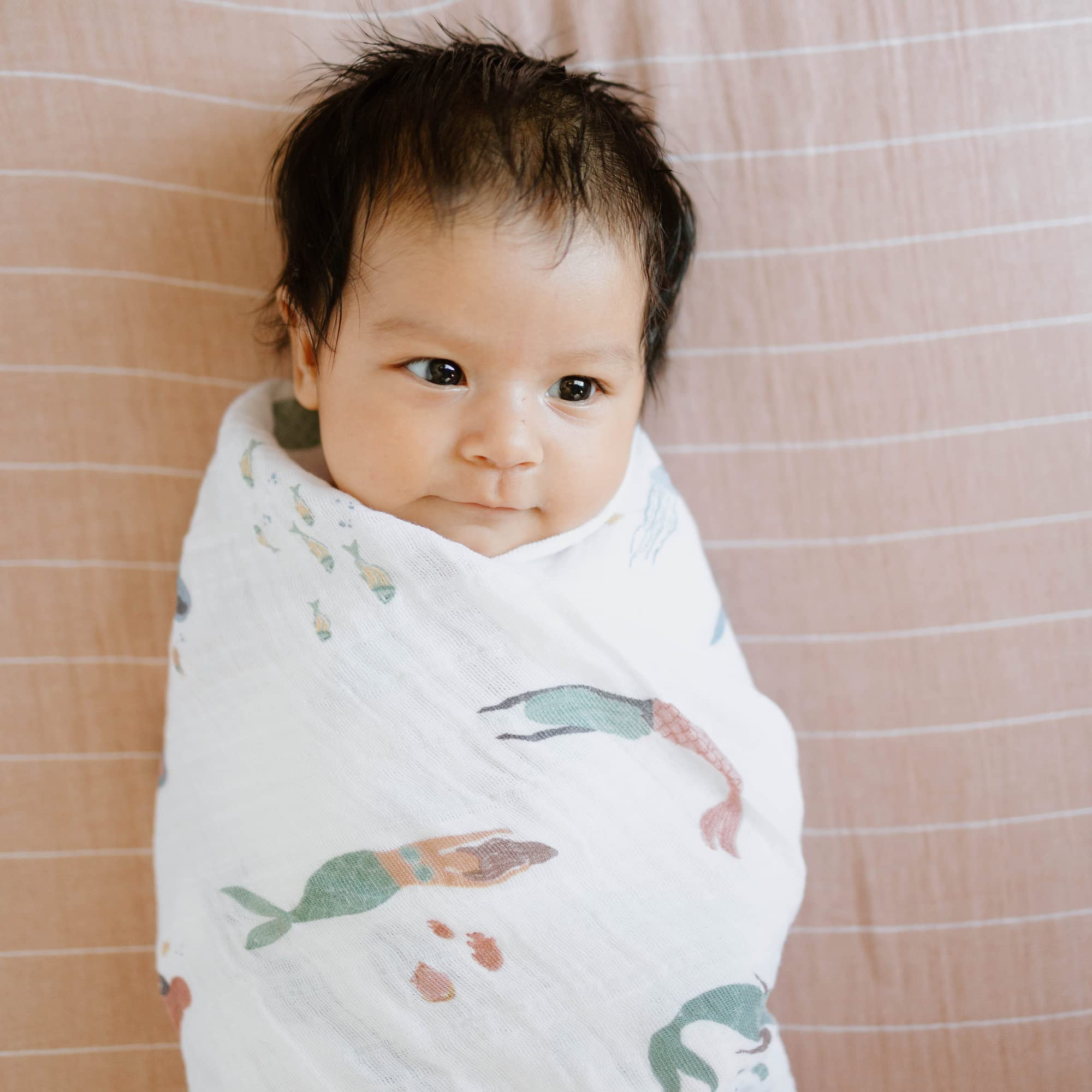 Little Unicorn Mermaids Swaddle Dryer-Safe reveals machine-washable design for busy parents.