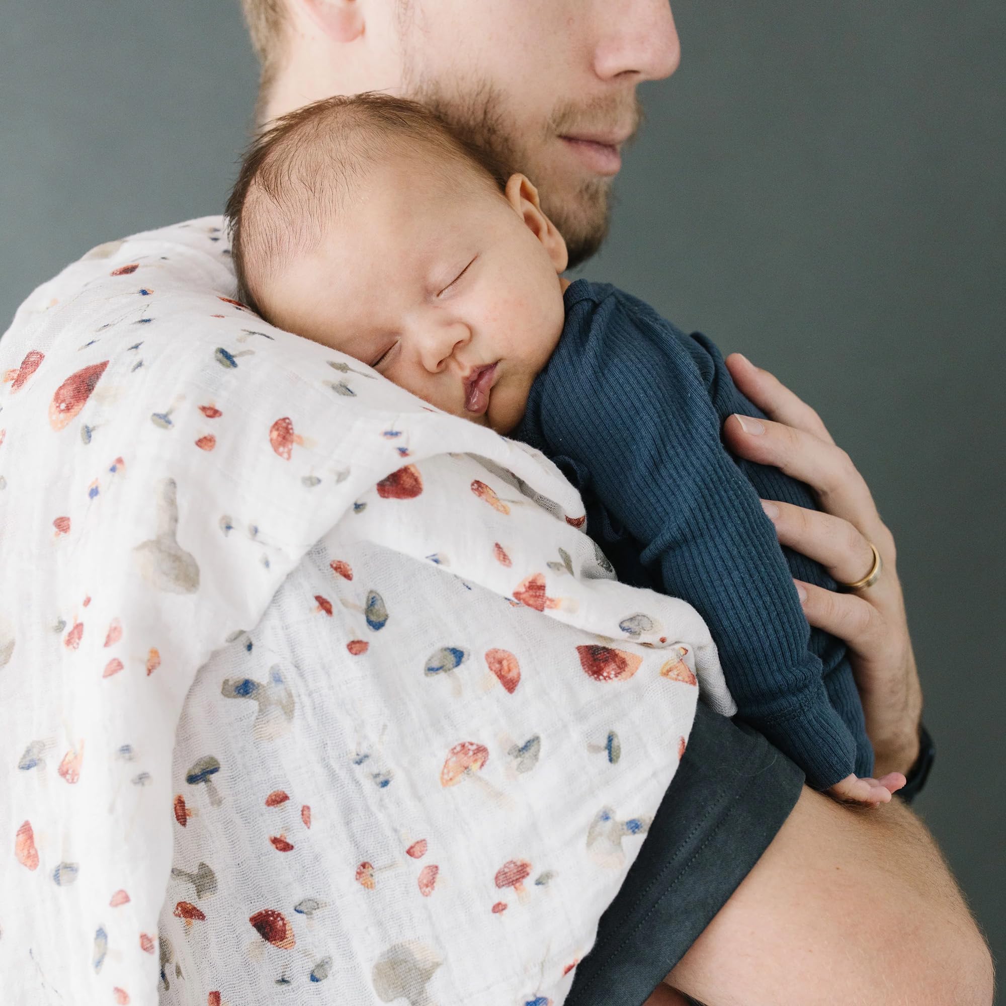 Little Unicorn mushrooms swaddle car-seat-wrap doubles as burp cloth between outings.