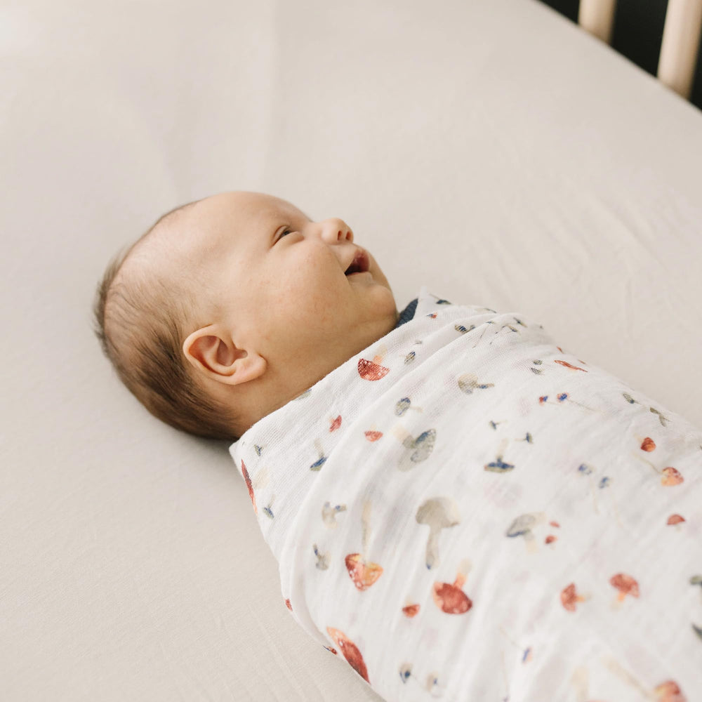 Little Unicorn mushrooms swaddle easy-care fabric stays colorfast in laundry.