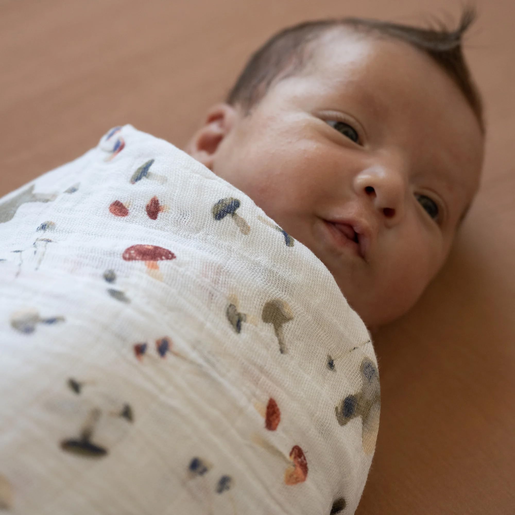 Little Unicorn mushrooms swaddle stroller-cover offers lightweight shade on strolls.