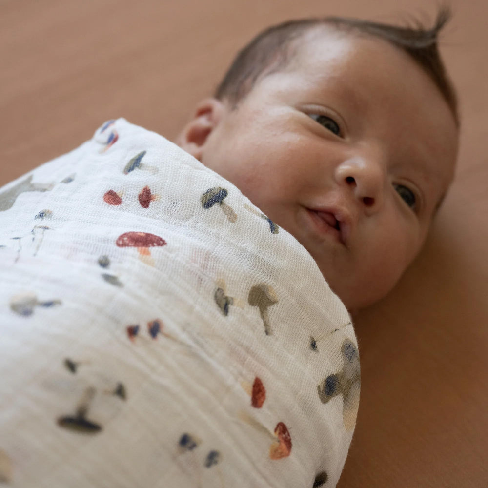 Little Unicorn mushrooms swaddle stroller-cover offers lightweight shade on strolls.