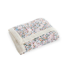 Little Unicorn newborn quilt used as stroller cover for breathable protection on the go.