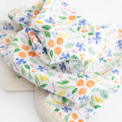 Little Unicorn newborn receiving quilt four-layer muslin closeup highlights breathable fabric and durable stitching.