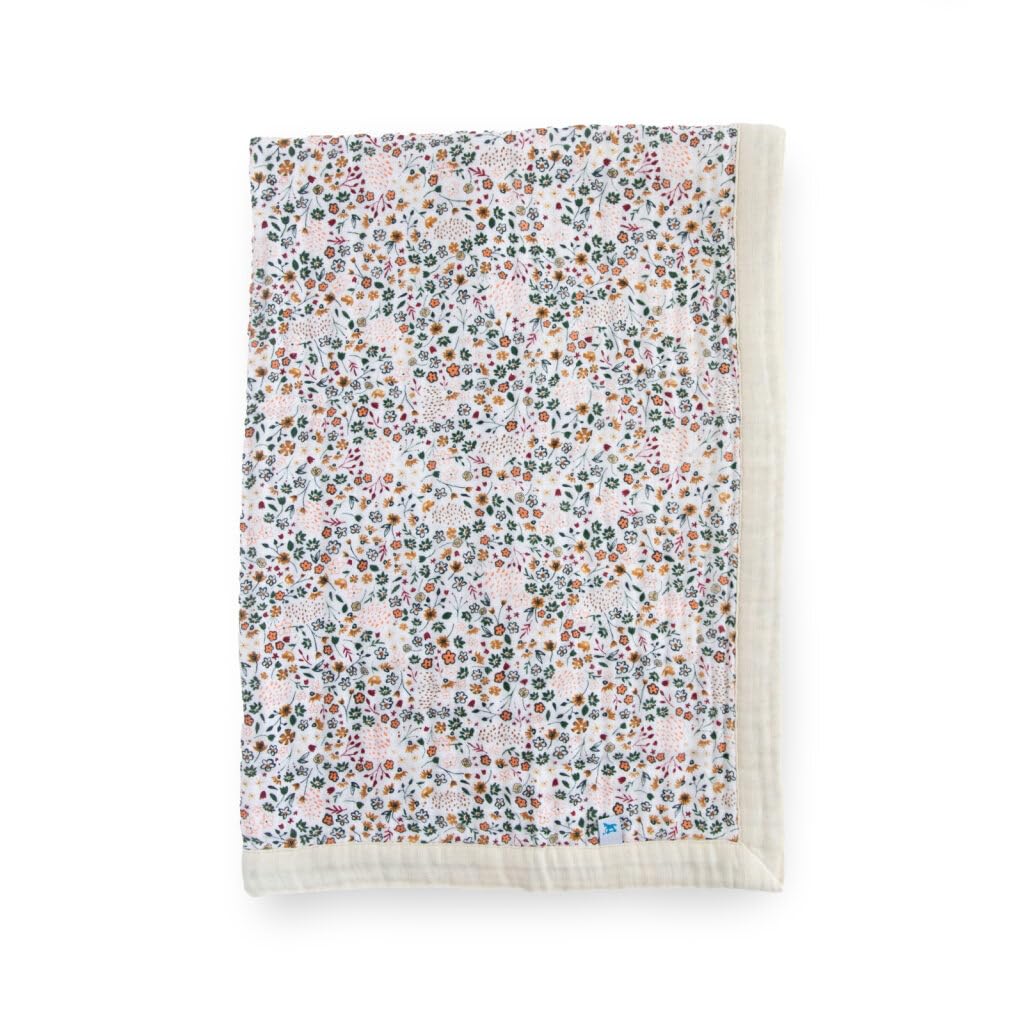 Little Unicorn newborn receiving quilt with 4-layer muslin softness for cozy cuddles.