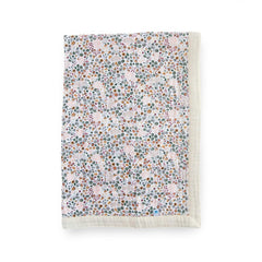 Little Unicorn newborn receiving quilt with 4-layer muslin softness for cozy cuddles.