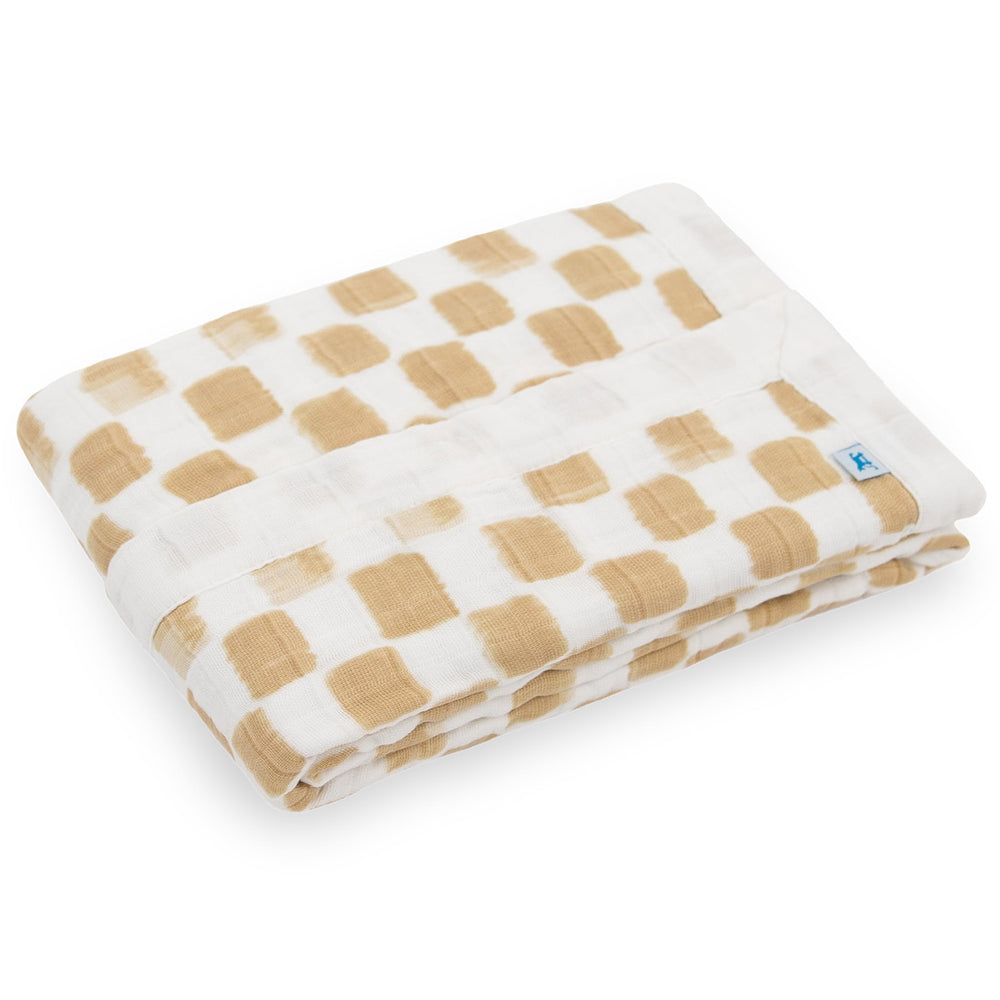 Little Unicorn four-layer muslin quilt highlights breathable warmth for naps and playtime.
