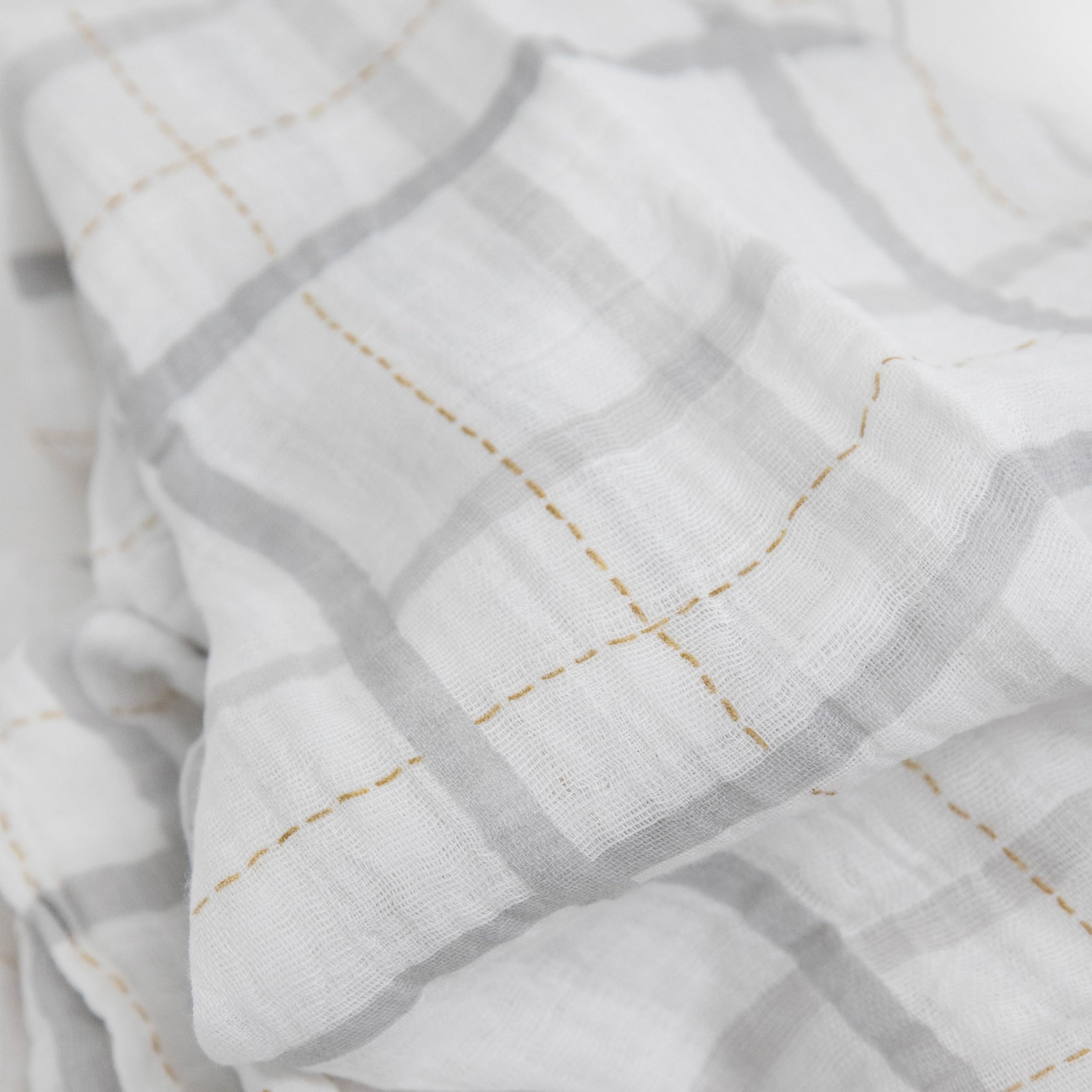 Little Unicorn nursing moment – swaddle doubles as a light nursing cover.