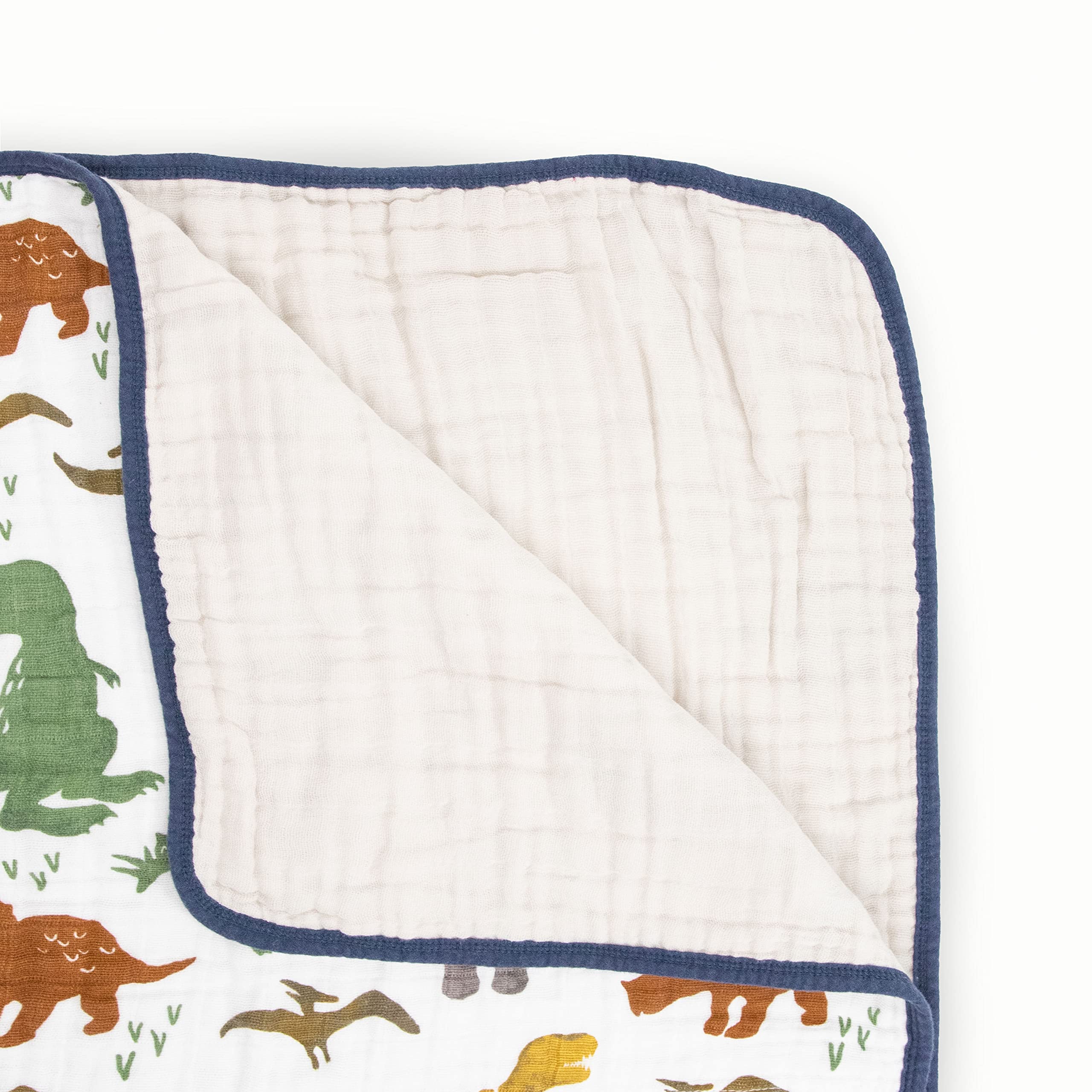 Close-up of Little Unicorn Dino Friends muslin fabric highlighting breathable softness