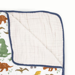 Close-up of Little Unicorn Dino Friends muslin fabric highlighting breathable softness