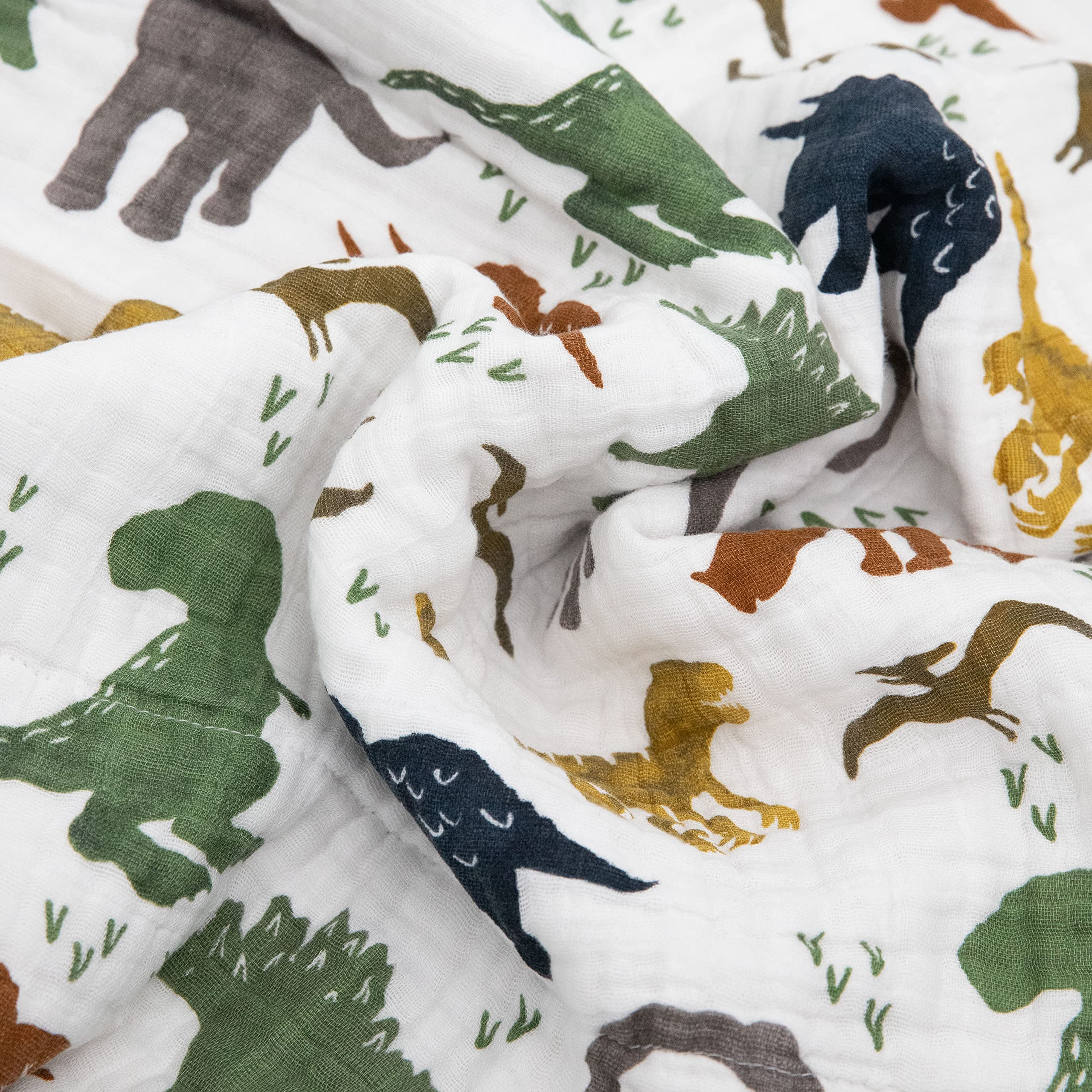 Stitched detail on Little Unicorn Dino Friends quilt showing durable bias binding