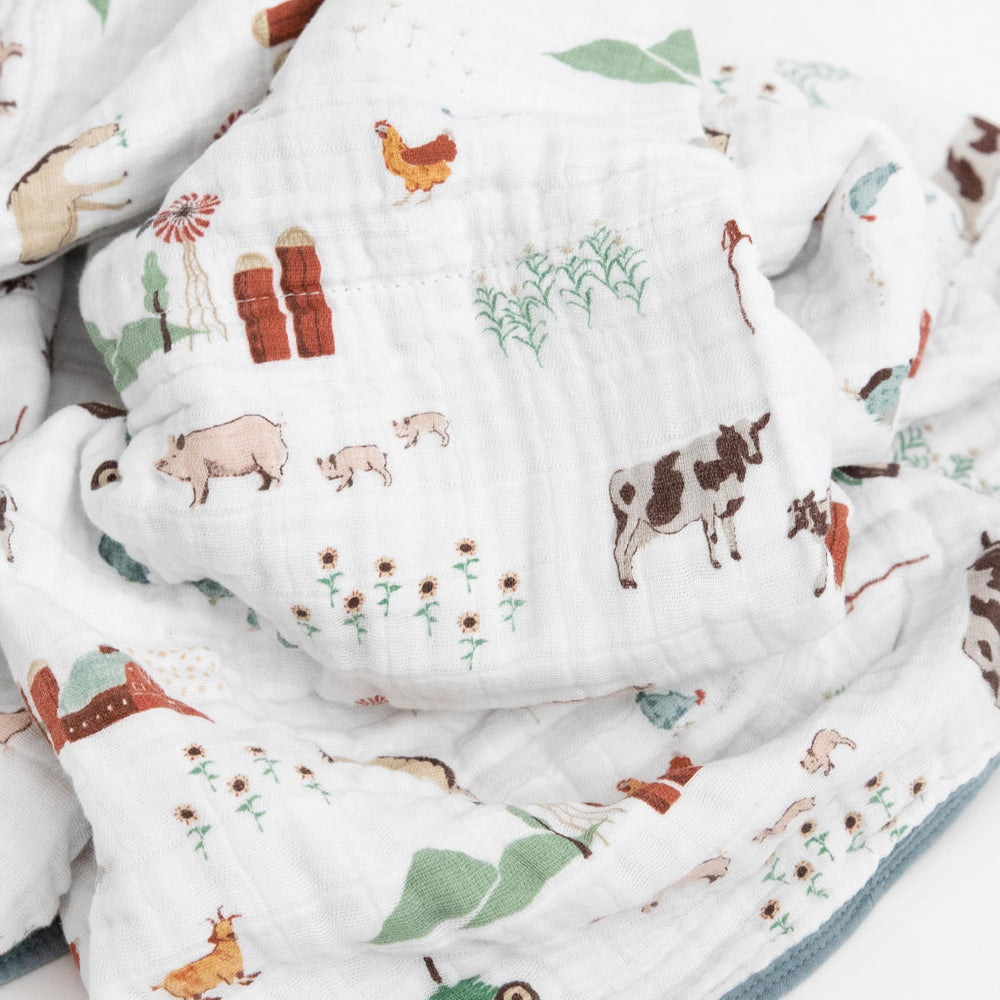 Little Unicorn quilt farmyard on the go with lightweight design for travel snuggles