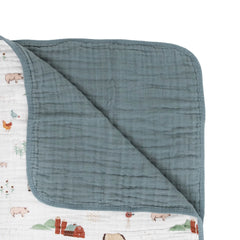 Little Unicorn quilt farmyard snuggle time scene highlights ultra-soft muslin for cozy mornings