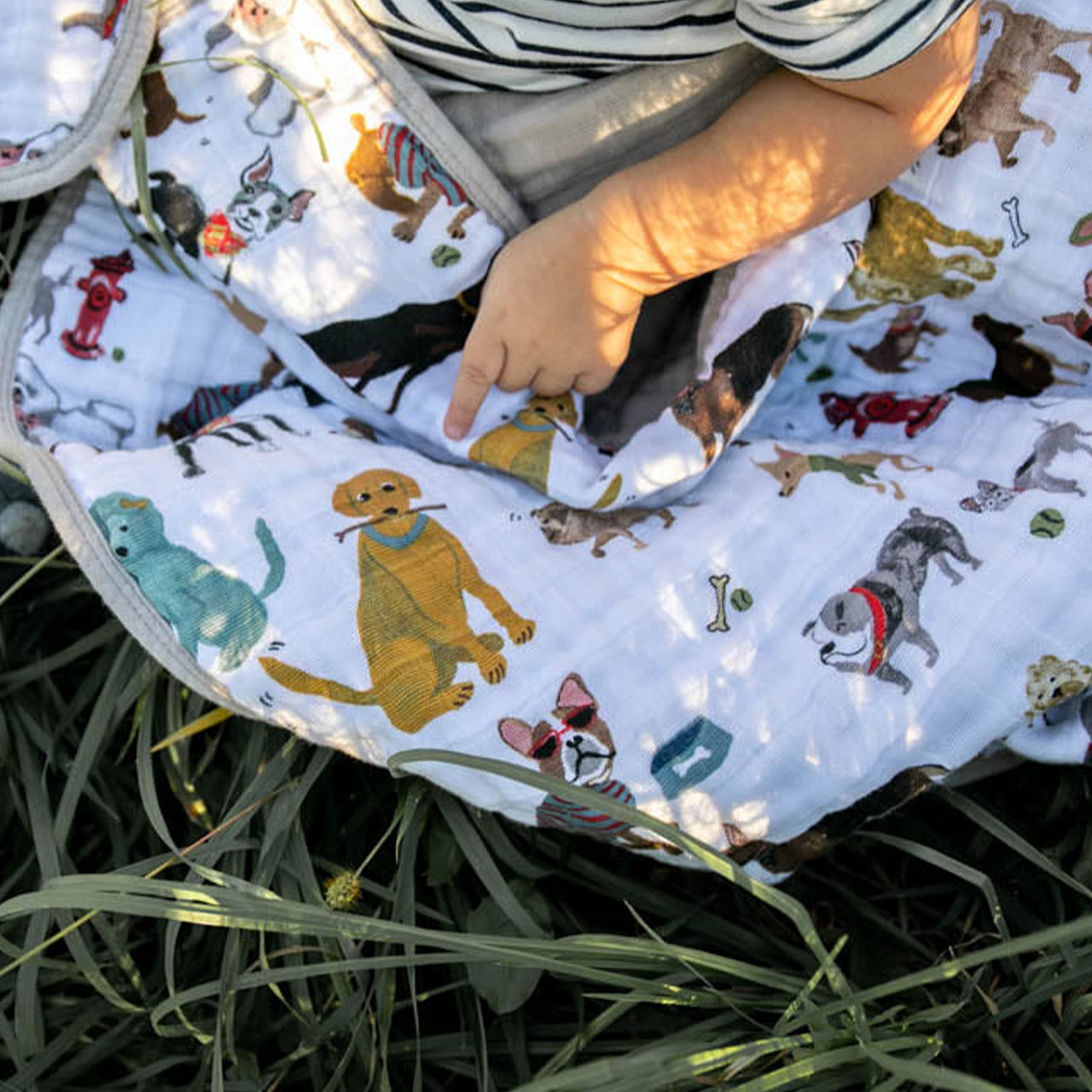Little Unicorn Original quilt car-seat wrap provides soft warmth during travel.