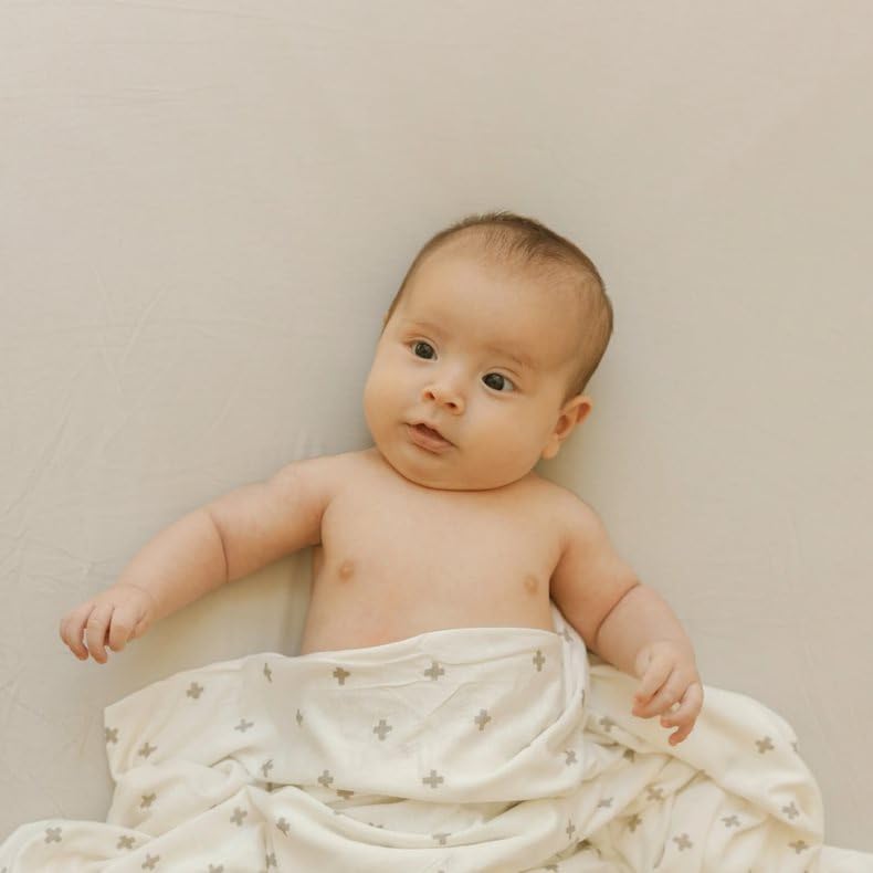 Little Unicorn Pebble stretch knit crib sheet with corner elastic for secure fit.