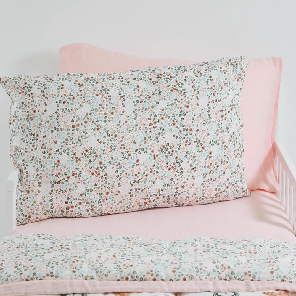 Little Unicorn pillowcase envelope closure closeup demonstrates secure fit for standard pillow