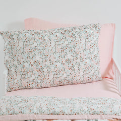 Little Unicorn pillowcase envelope closure closeup demonstrates secure fit for standard pillow
