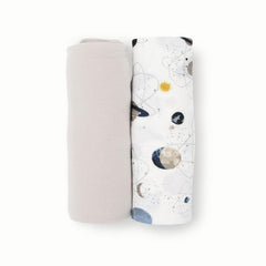 Little Unicorn planets swaddle worn by baby for secure comfortable sleep