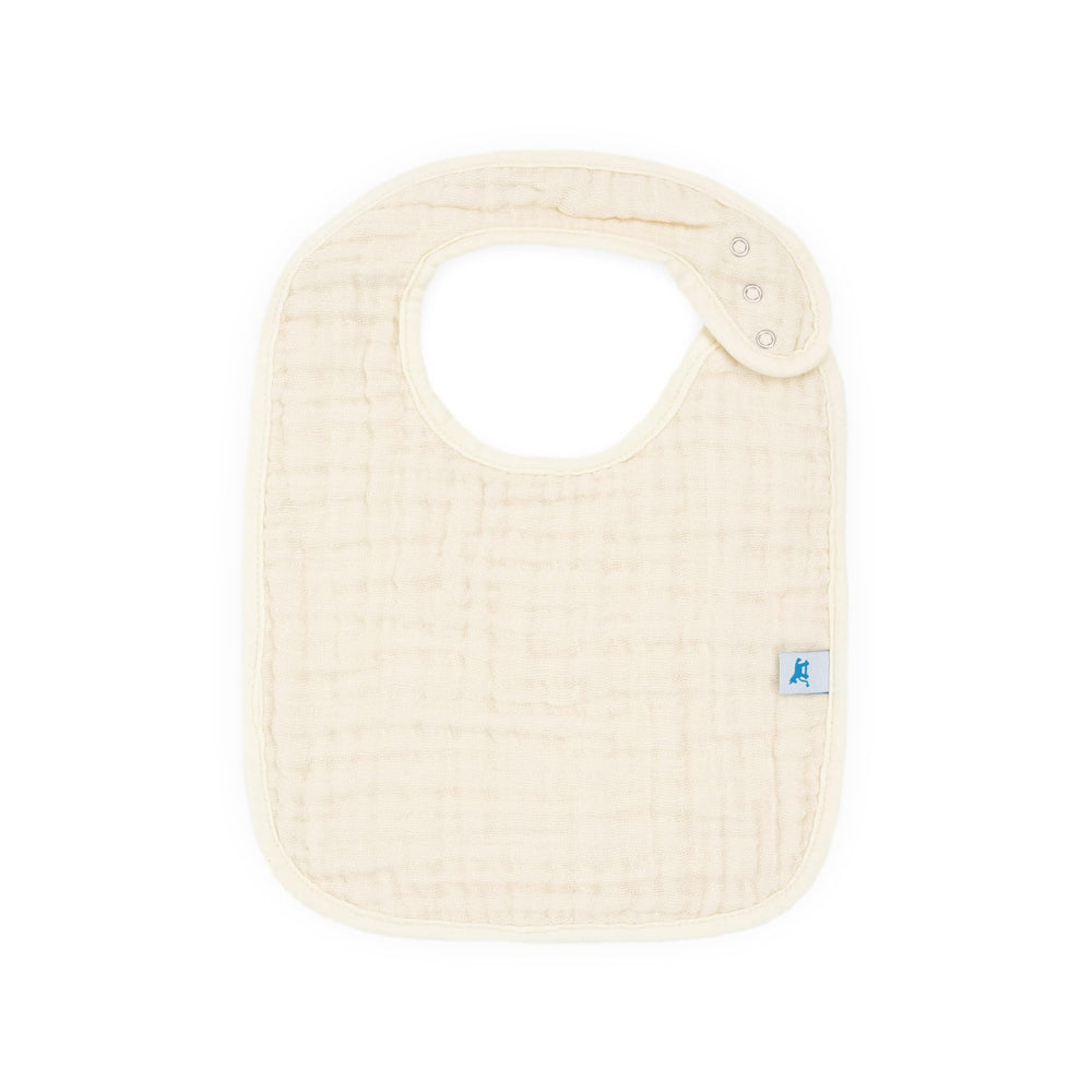 Little Unicorn bib adjustable snap closure shows growing baby fit up to 3 years.