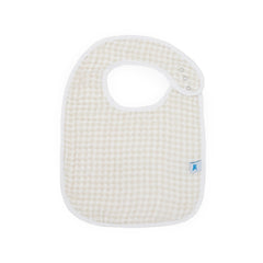 Little Unicorn Premium Classic Bib featuring whimsical patterns to complement nursery decor and first mealtime moments