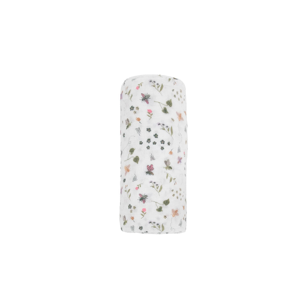Little Unicorn premium cotton swaddle on a baby showing easy swaddling and secure wrap.