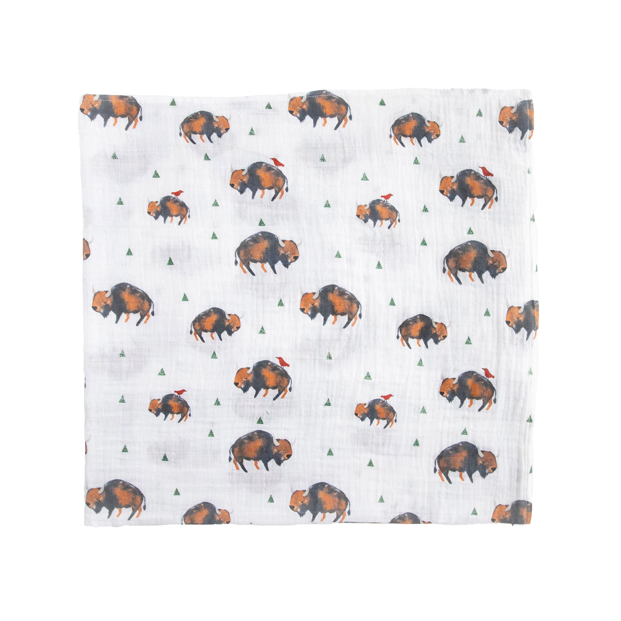 Little Unicorn swaddle blanket on floor during playtime in cozy nursery.