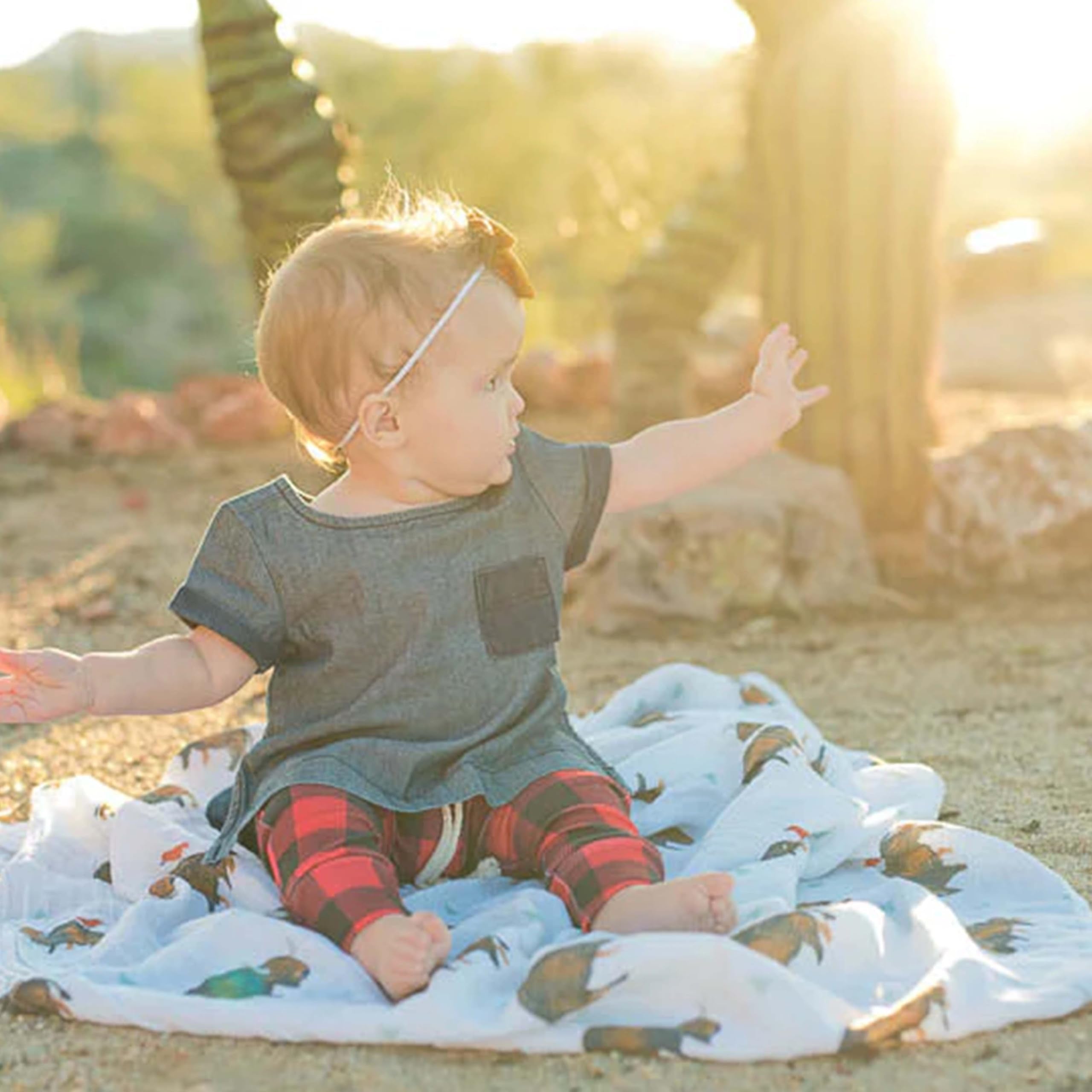 Little Unicorn premium cotton swaddle blanket folded neatly for storage and care.
