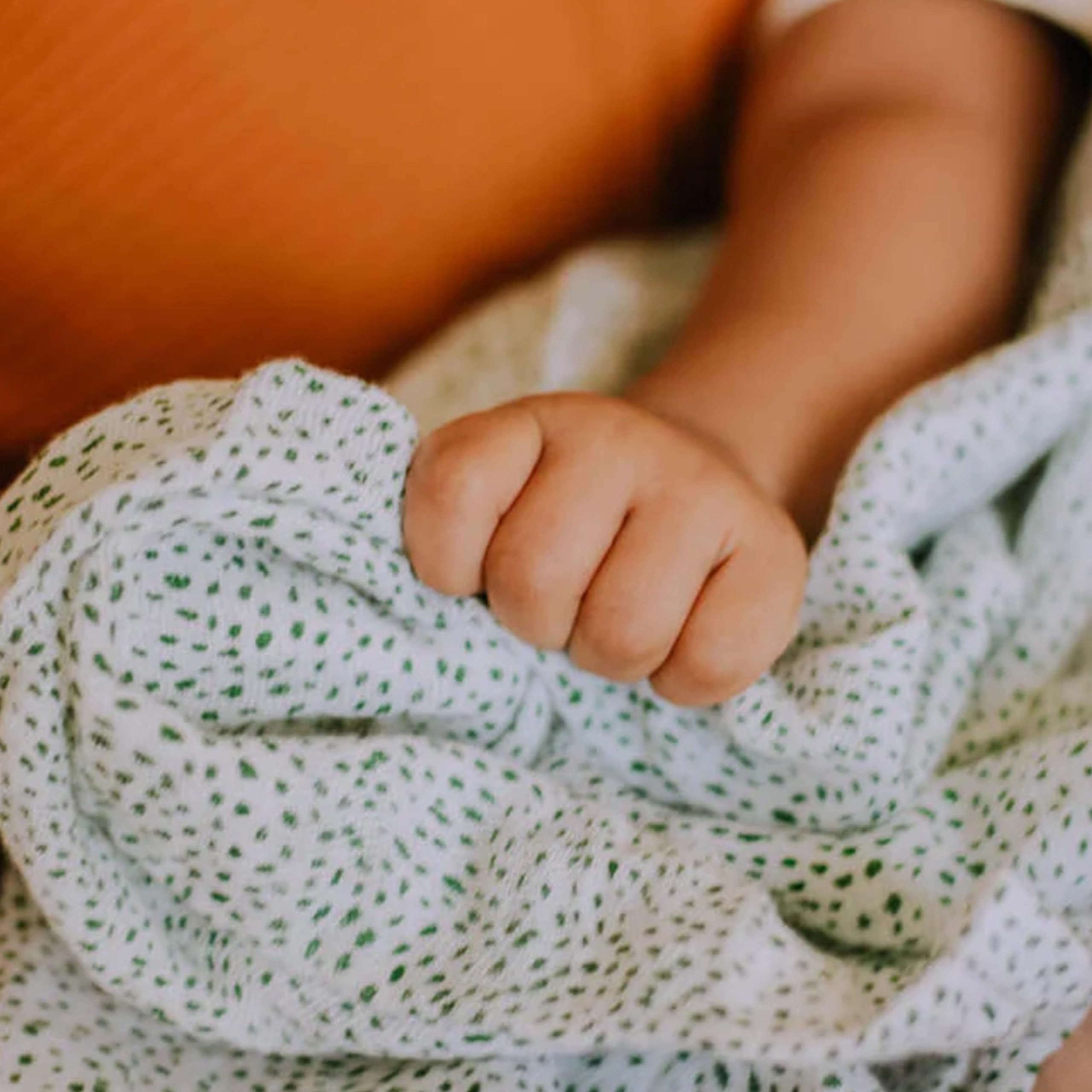 Little Unicorn swaddle size-conscious layout highlighting ample coverage for swaddling and nursing.
