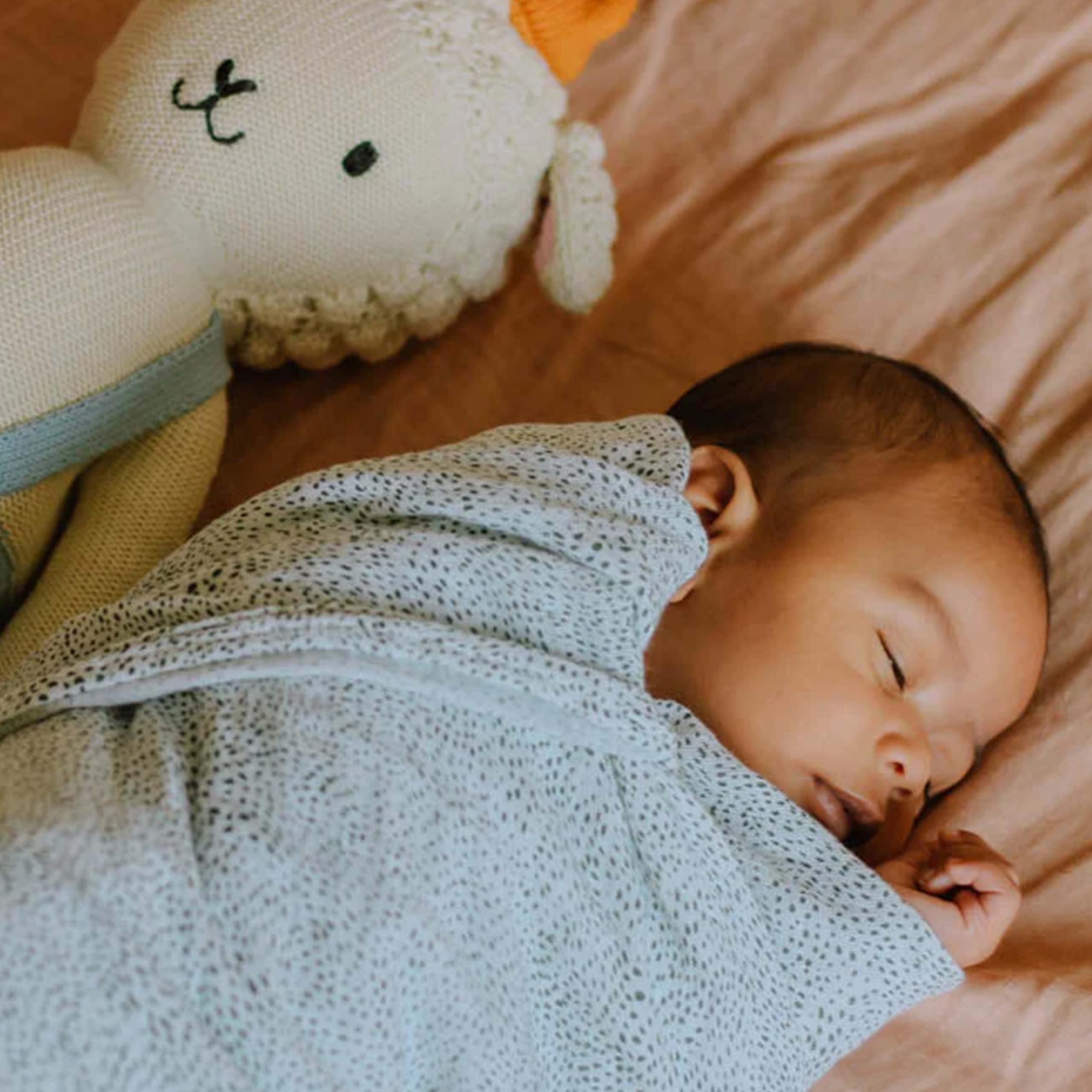 Little Unicorn swaddle Green Seed color tones brighten nursery while breathable cotton comfort.