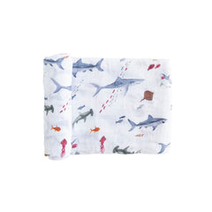 Little Unicorn shark-pattern swaddle blanket in premium cotton, breathable and cozy.