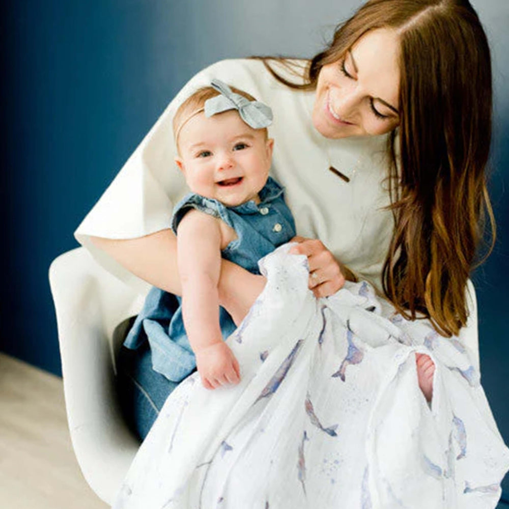 Little Unicorn swaddle wrapping car seat for breathable safety on trips.