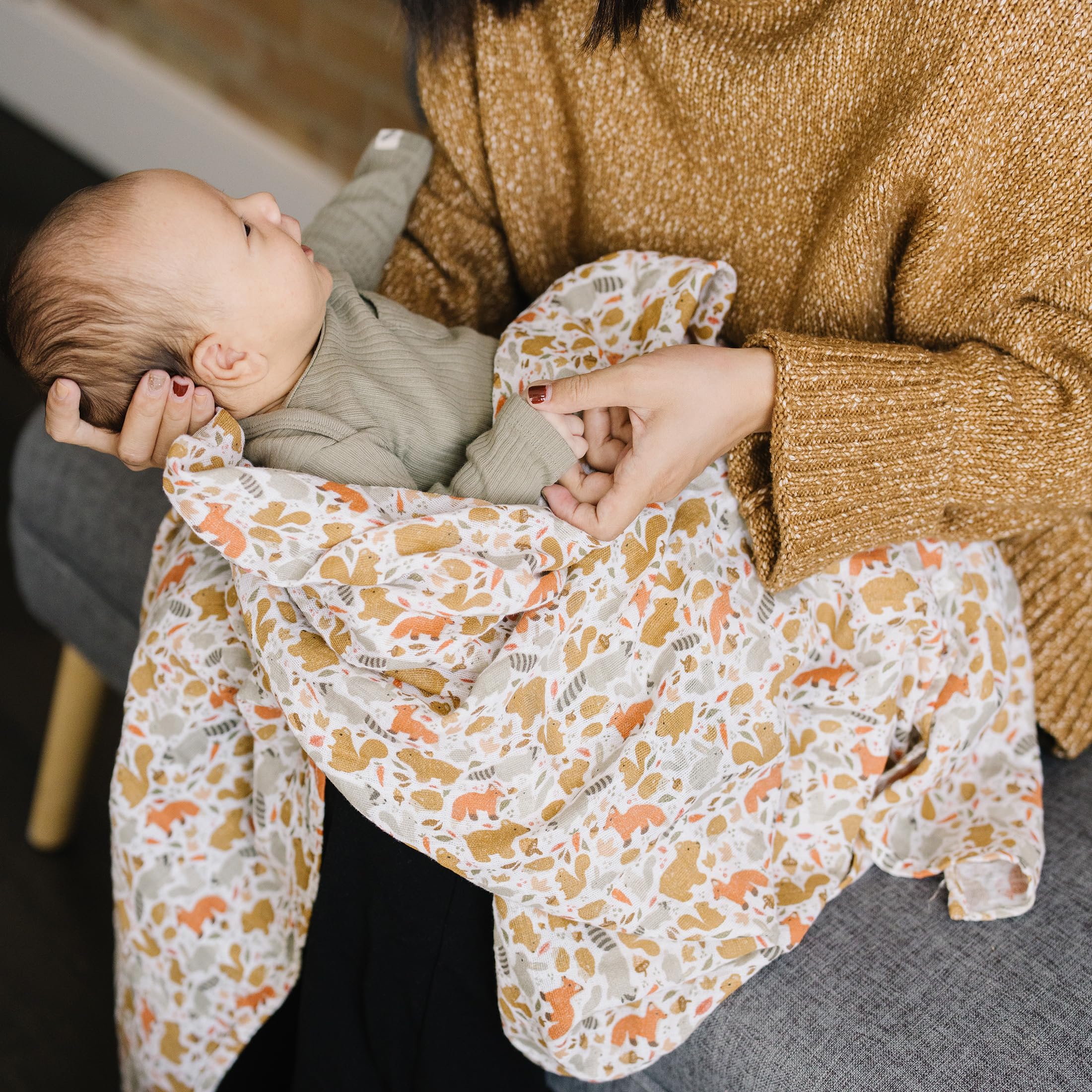 Little Unicorn generous size swaddle for versatile swaddling, nursing and cuddling.