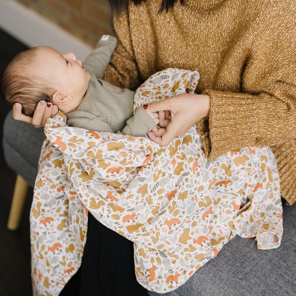 Little Unicorn generous size swaddle for versatile swaddling, nursing and cuddling.