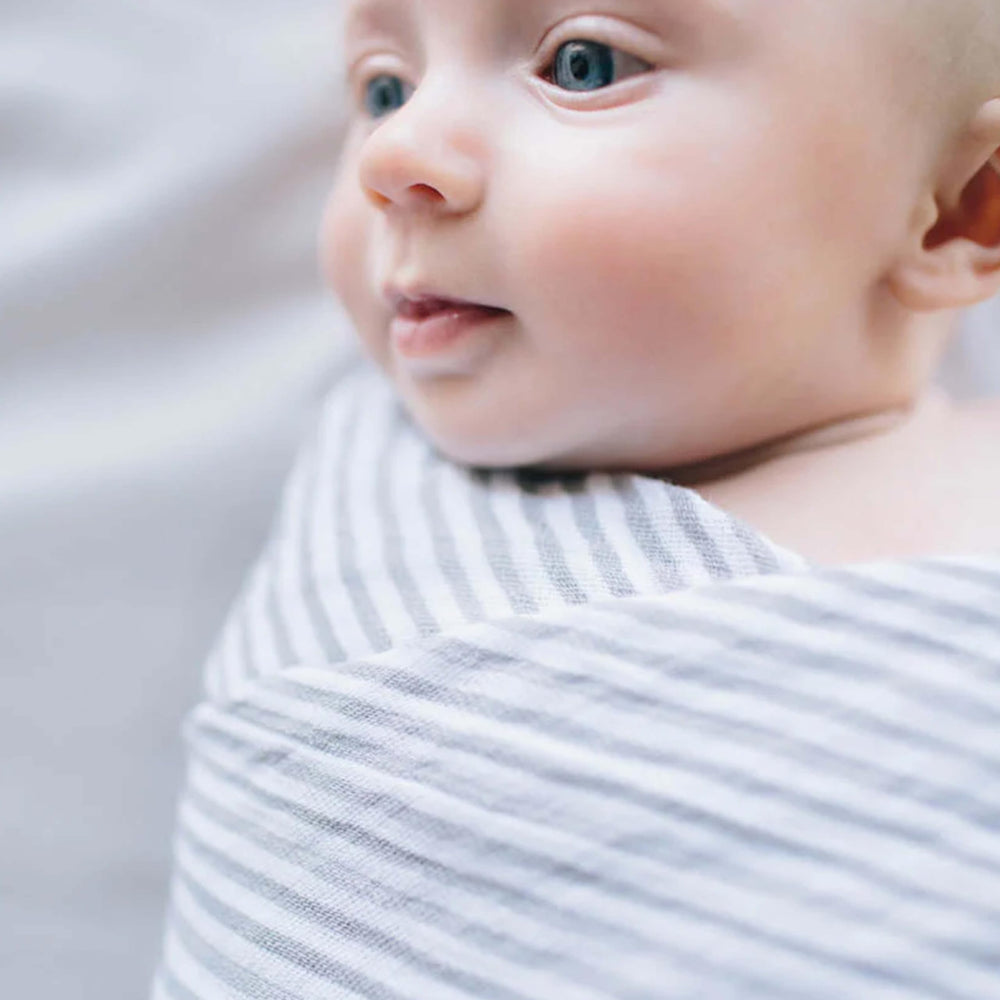 Little Unicorn grey stripe close-up showing soft muslin texture and weave