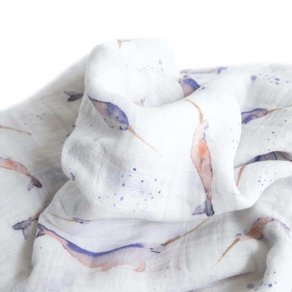 Little Unicorn swaddle in outdoor stroll setting for shade and comfort.