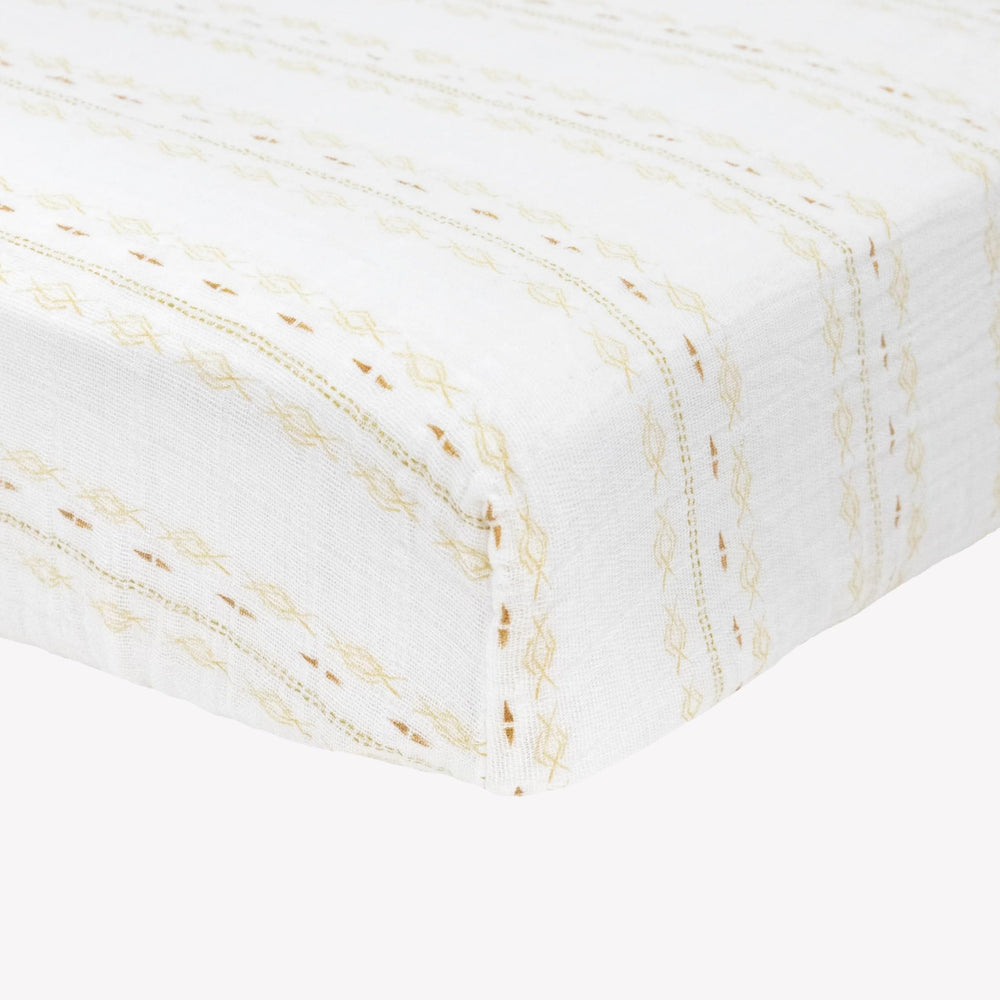 Little Unicorn Premium Crib Sheet on a crib mattress, snug fit and deep pockets.