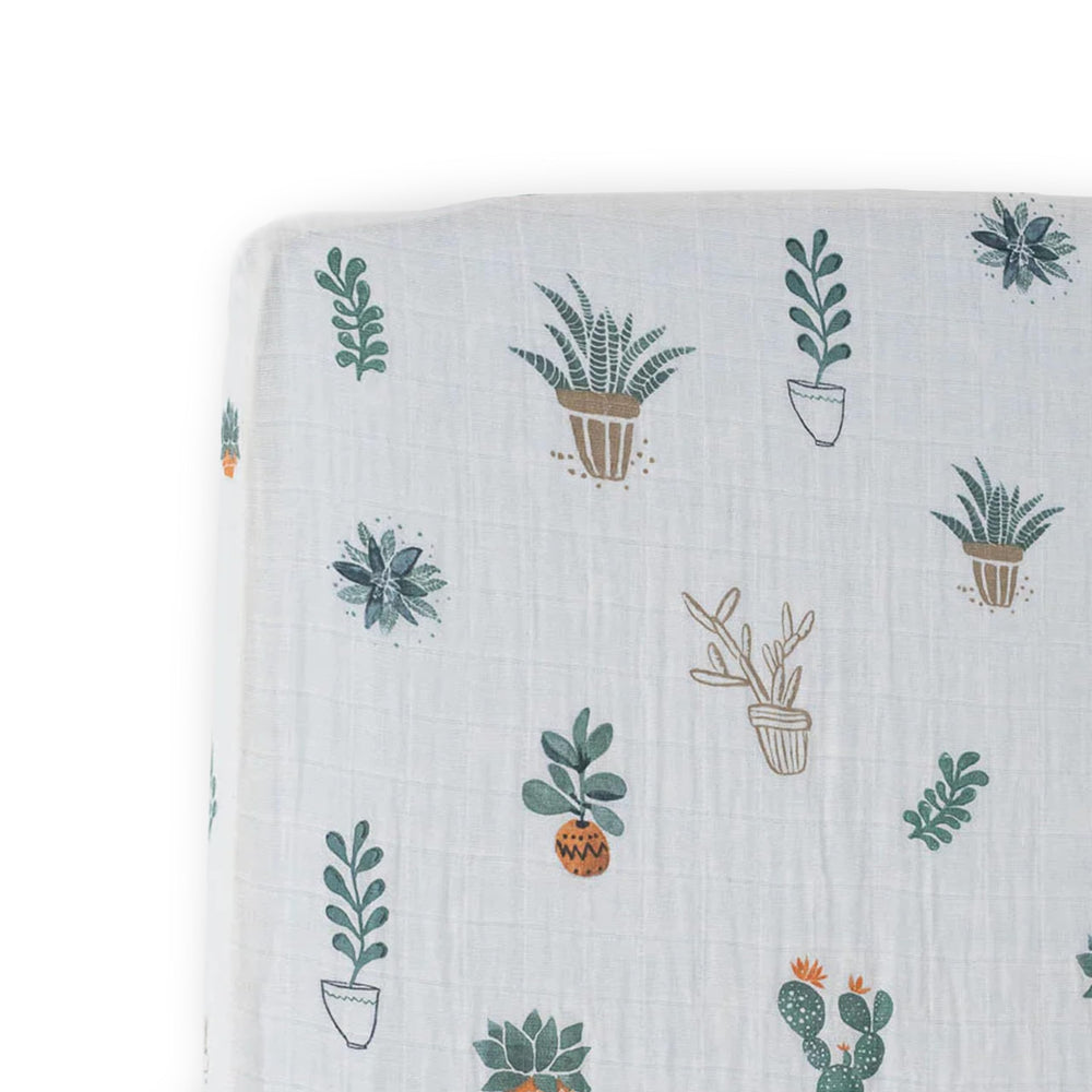 Little Unicorn Premium Crib Sheet Prickle Pots folded, highlighting soft muslin for gentle sleep