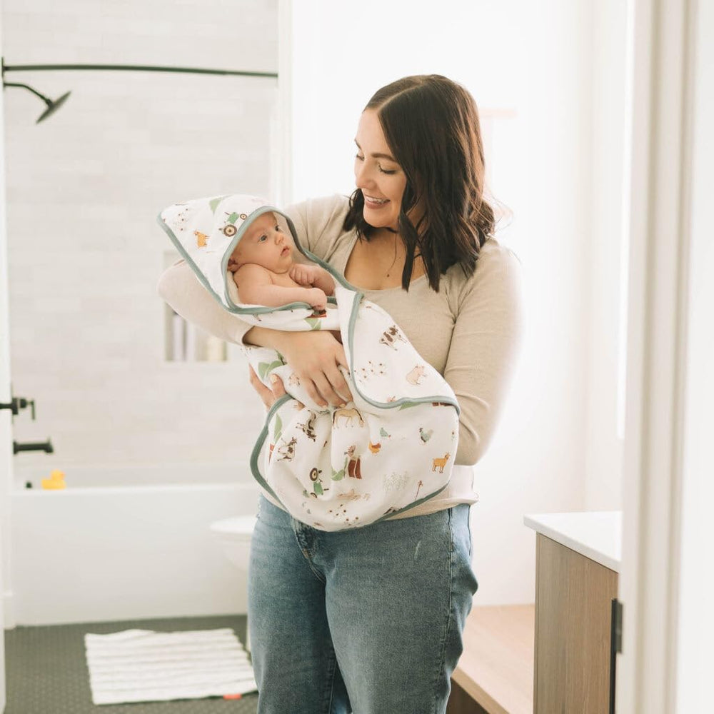 Little Unicorn 30x30 inches towel demonstrates generous newborn coverage.
