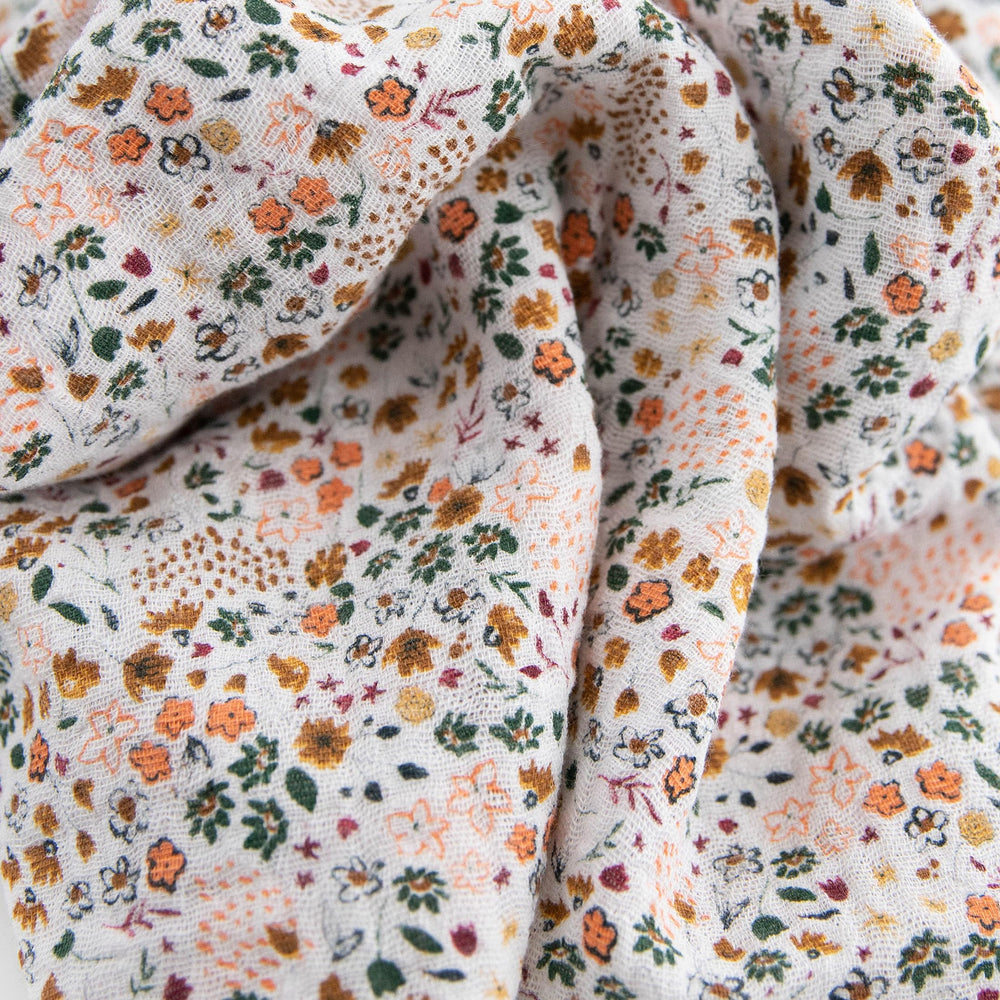 Little Unicorn swaddle set pressed petals design, lightweight blanket ideal for playtime and stroller use.