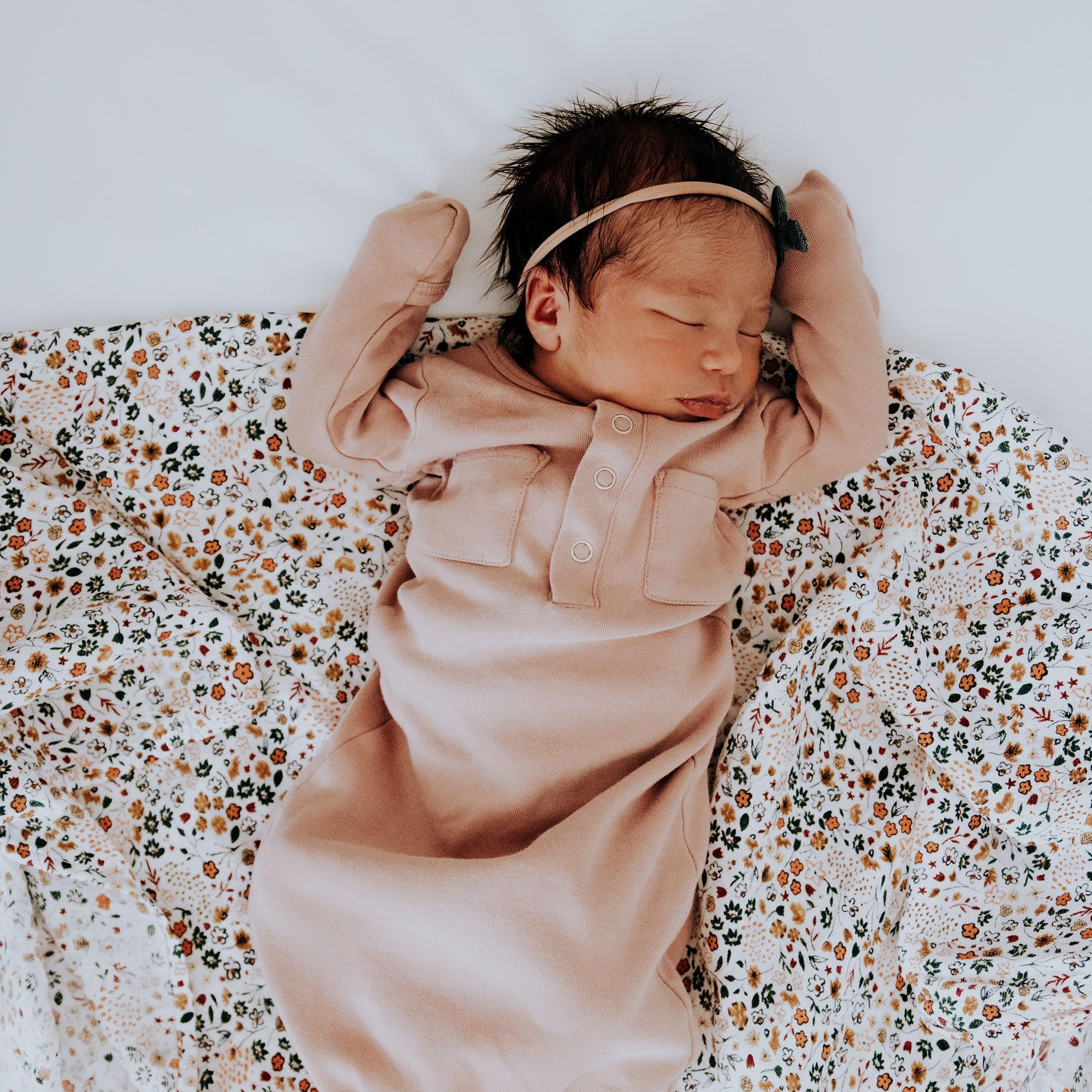 Little Unicorn swaddle blanket in nursery setting, gift-ready trio for baby gifting.